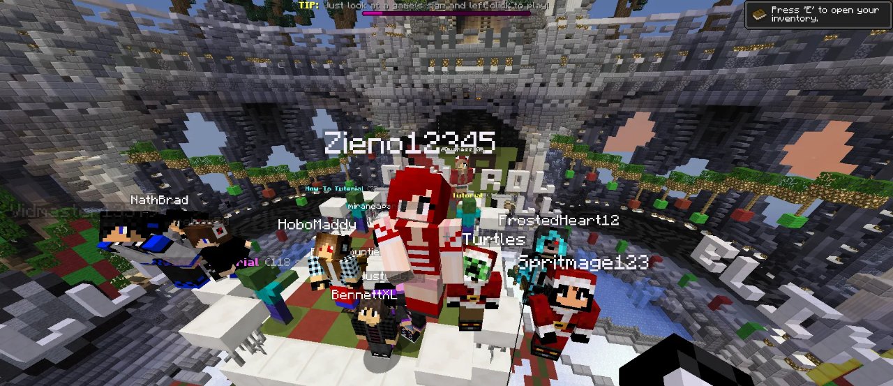 A crowd of players, several in Santa outfits, gathered on a platform in the decorated Avicus lobby
